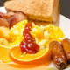 breakfast platter with ketchup on eggs
